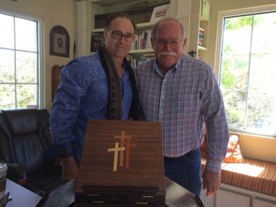 Larry Ciesla presenting Rev. Dr. William Lewis
                  the Jeffersonian Bookstand